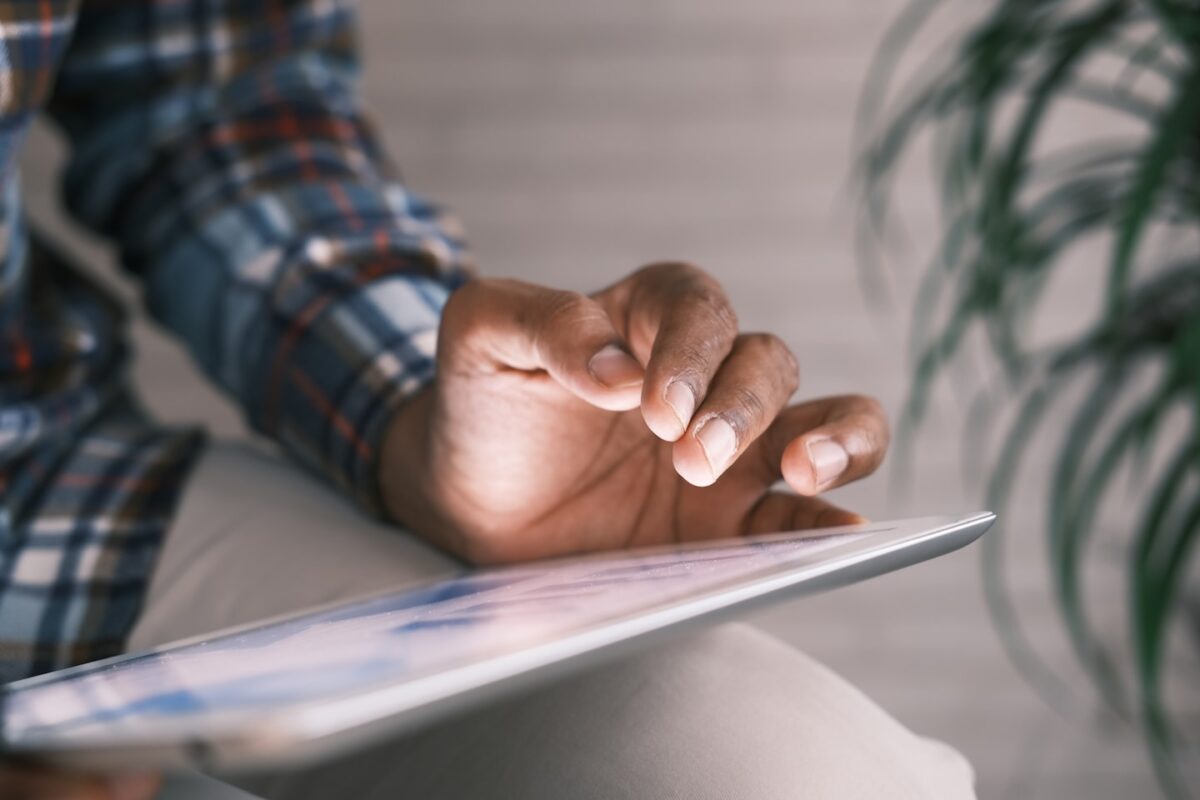 Person reading an interactive story on a tablet as part of a branching narrative experience